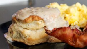 Ledgens Pizza biscuits and gray, eggs, and bacon breakfast