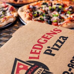 Ledgens Pizza is baked fresh in house, boxed hot and then ready for pizza delivery in Texas